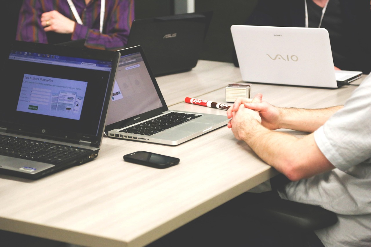 Business owner working on a laptop in a bright office